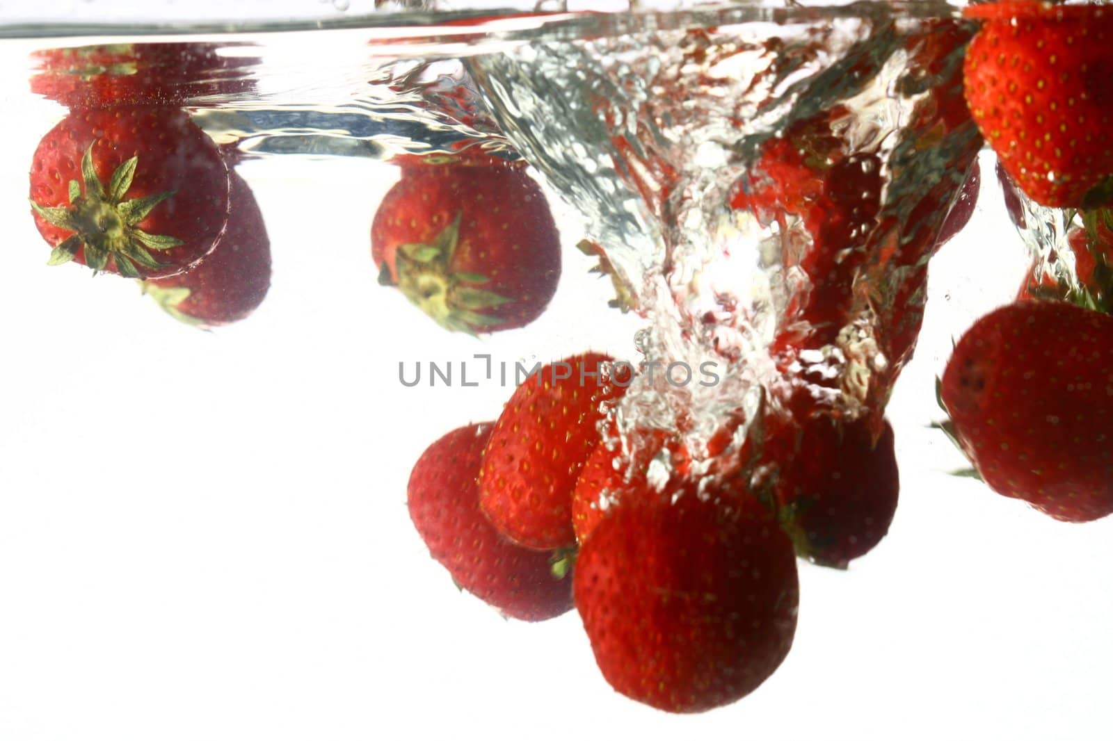 strawberry splash in water isolated on white background