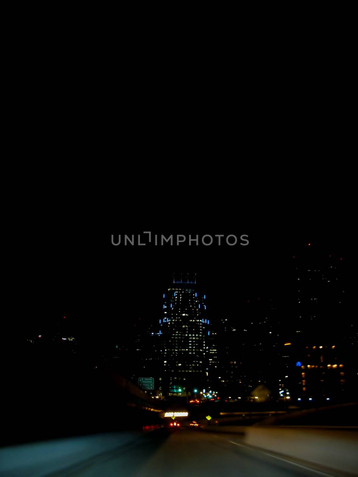 Nighttime highway scene - speeding through the city.