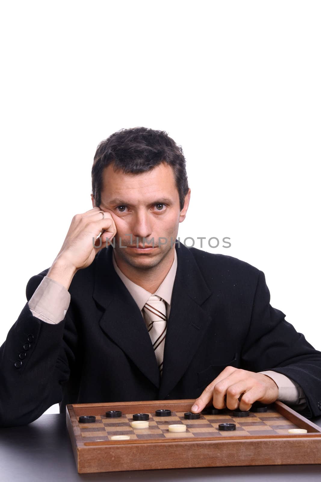 businessman playing chess over white background