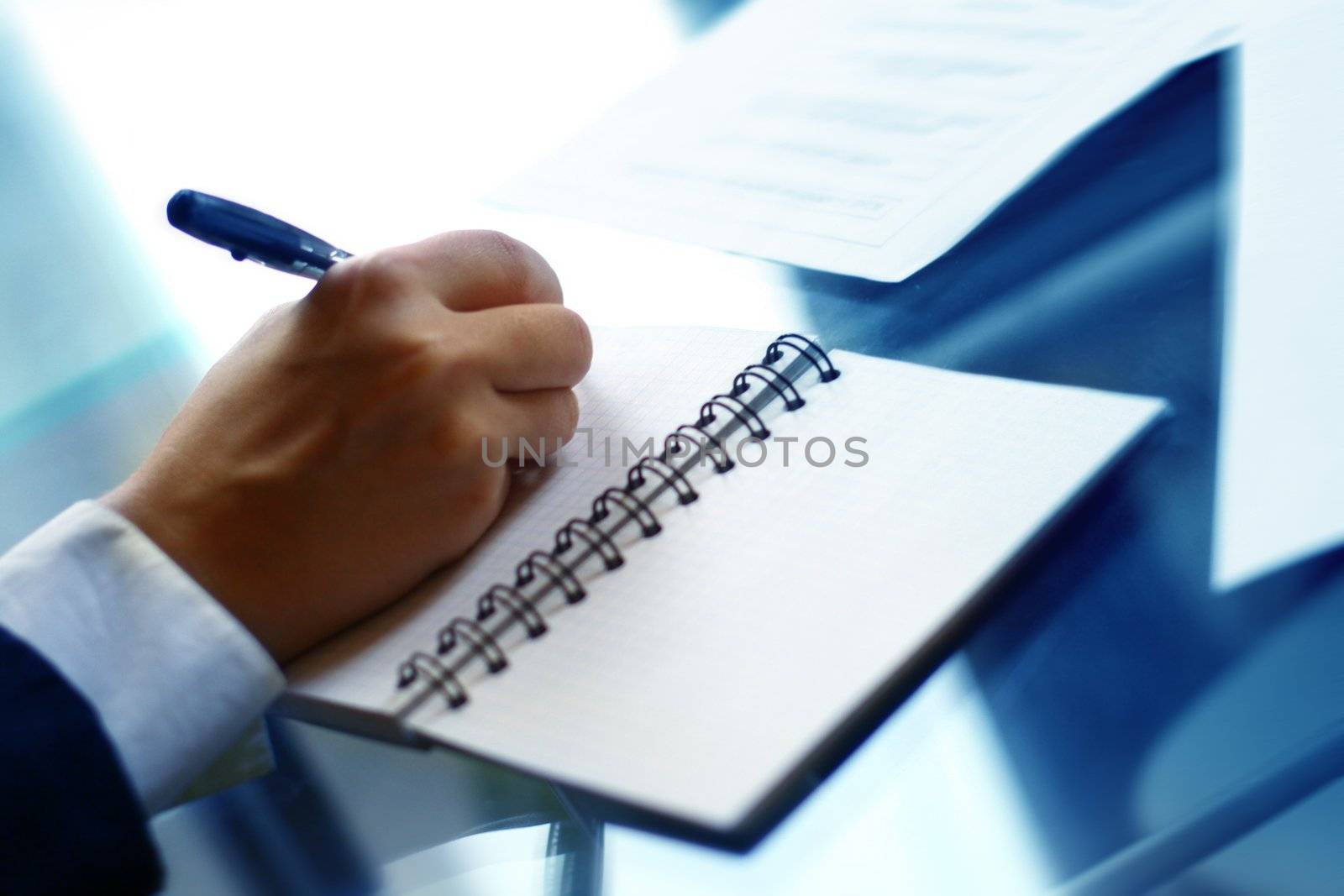 businessman hand write message in note 