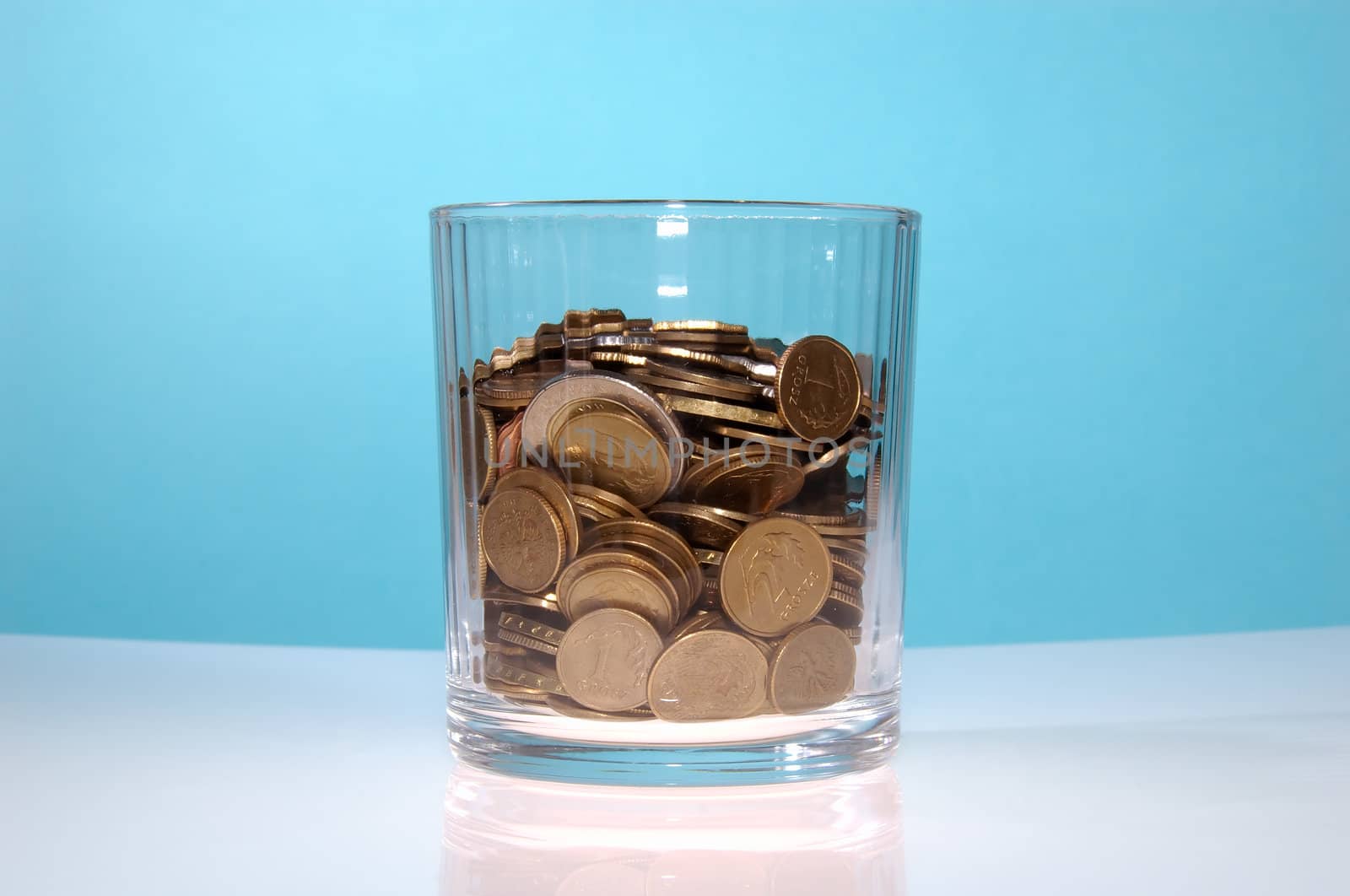 Transparent glass fulfilled of coin