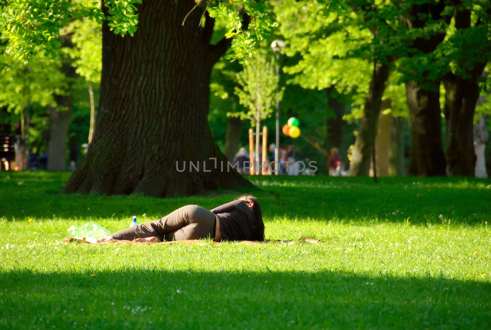 Young girl lying on the grass