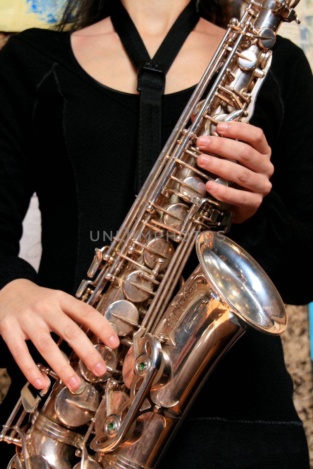 hands of musicinan playing Saxophone