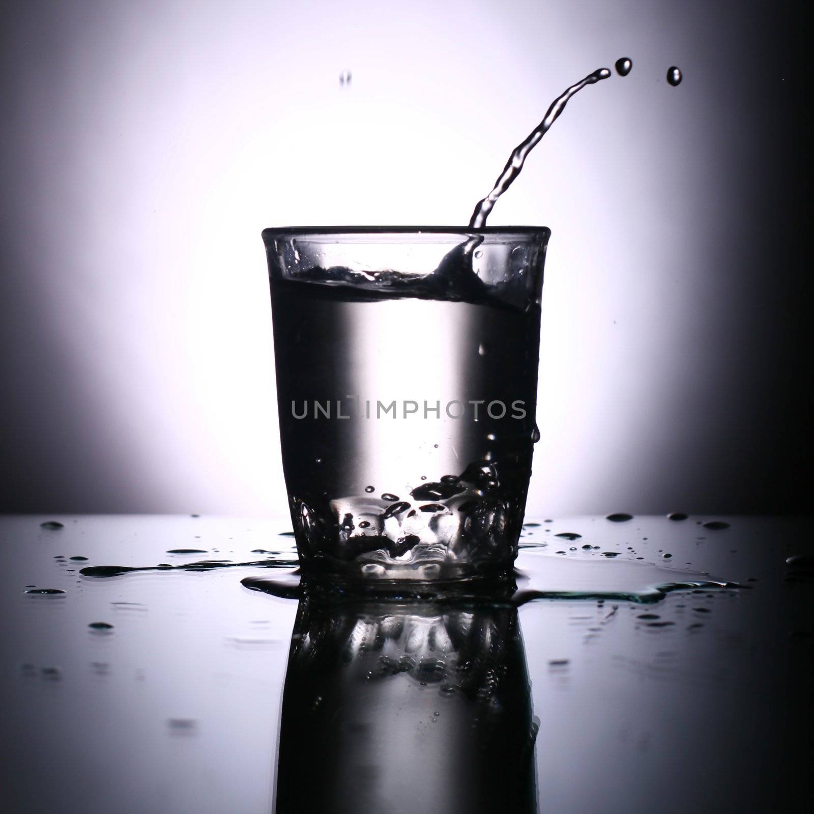 alcohol splash on gray background