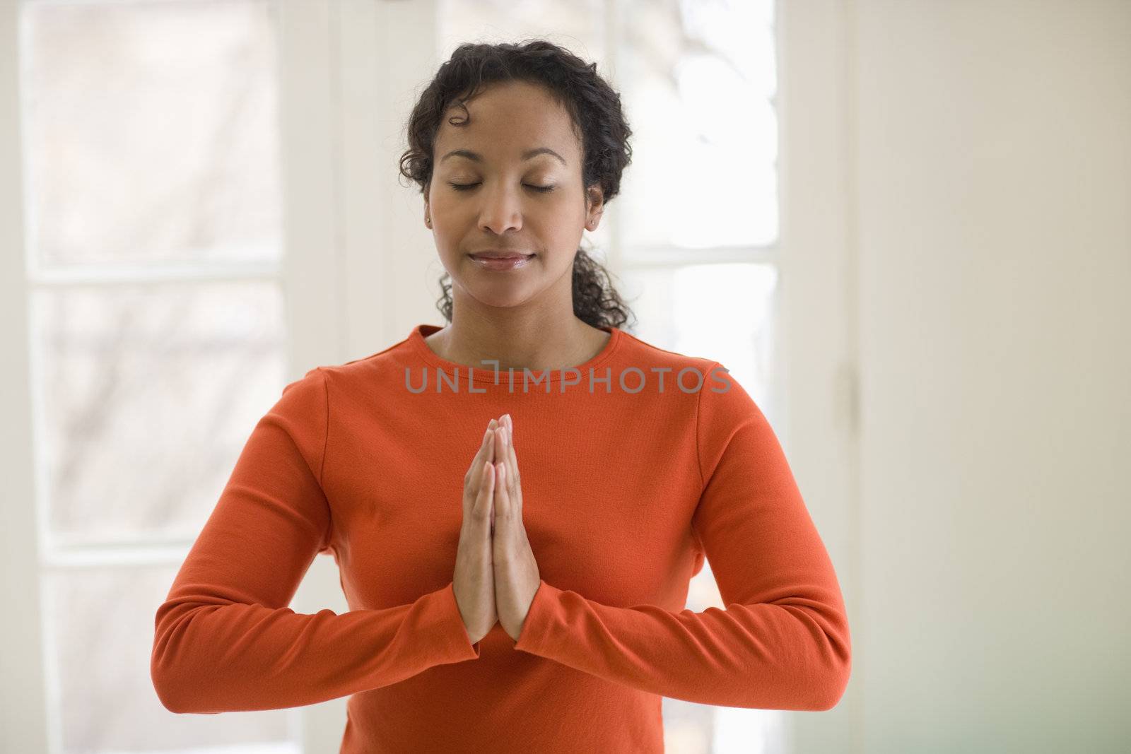 Young African American woman in yoga pose
