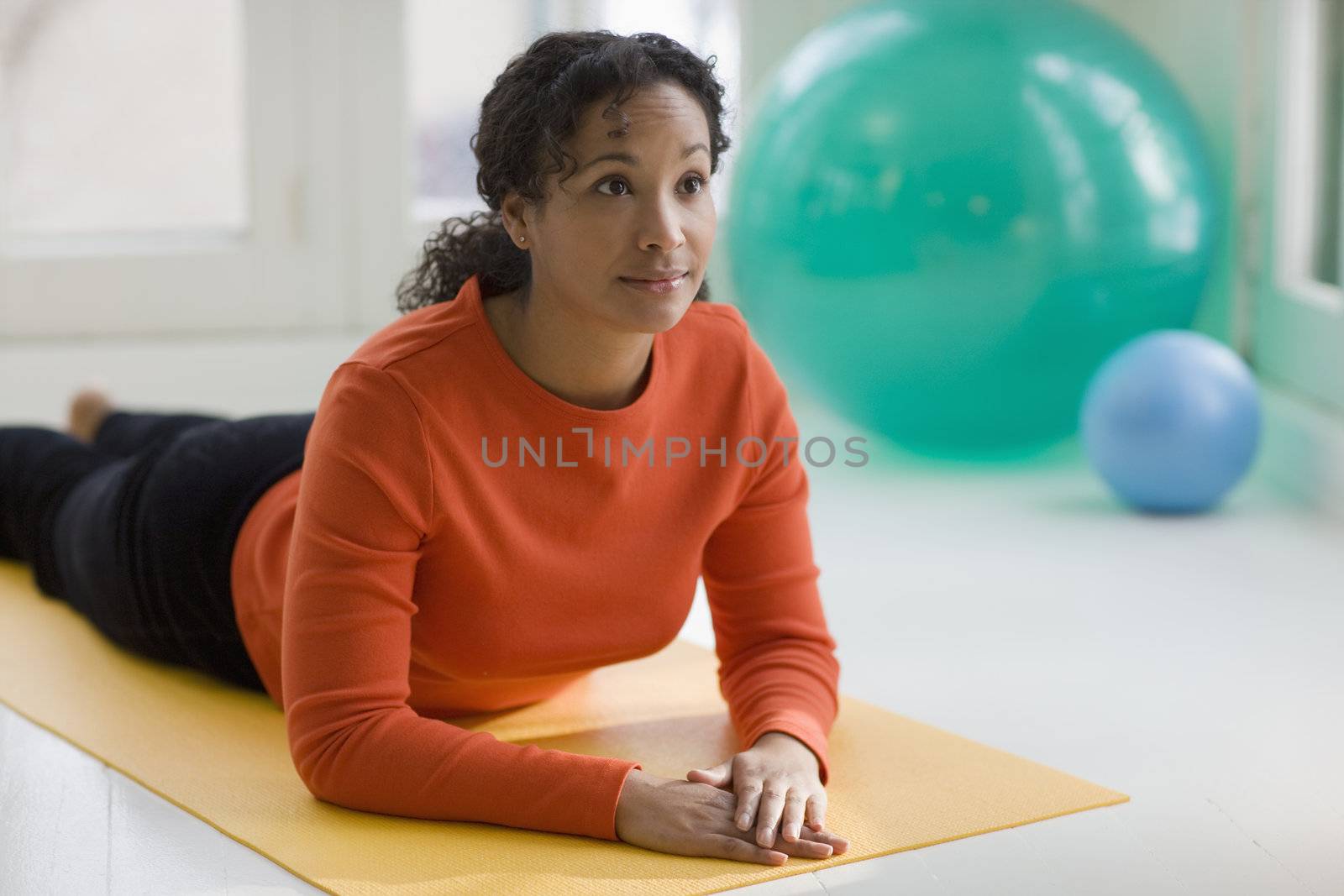 Attractive young African American woman in Sphinx pose