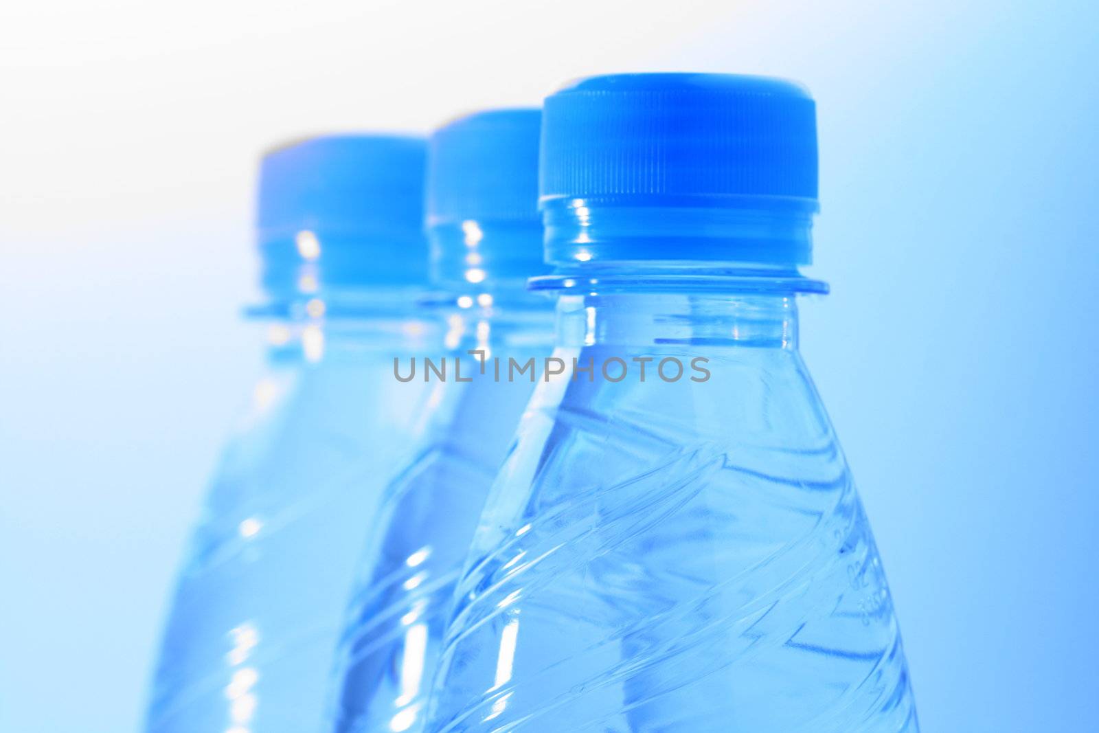 clear cold blue water in bottle