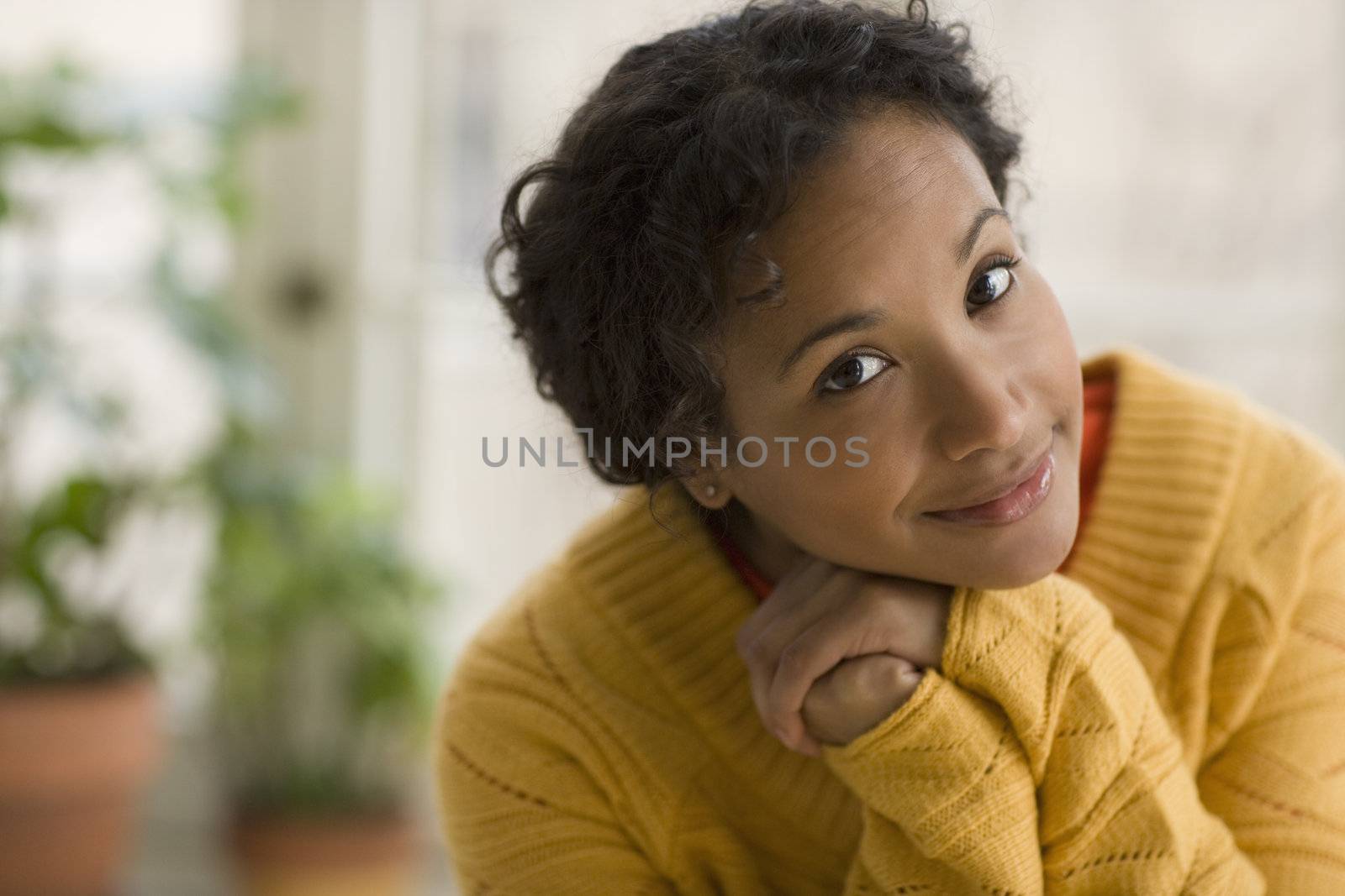 Pretty young black woman  by edbockstock