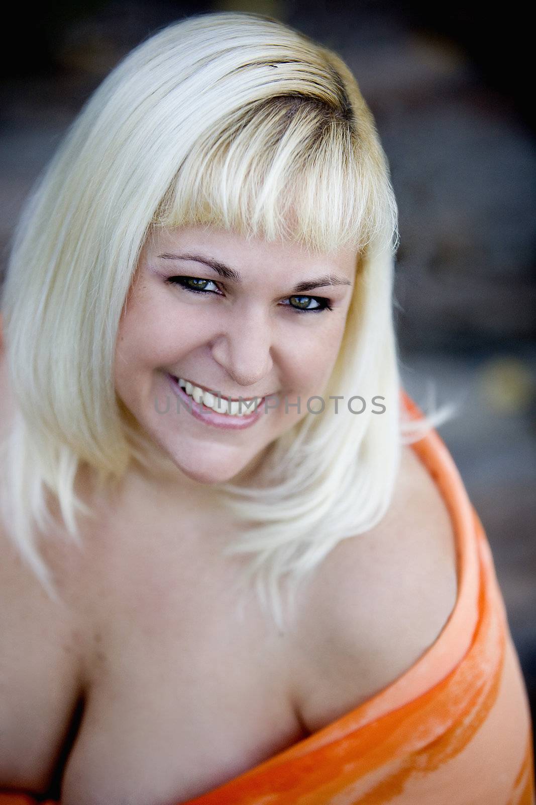 Sexy voluptuous blonde smiling by krazeedrocks
