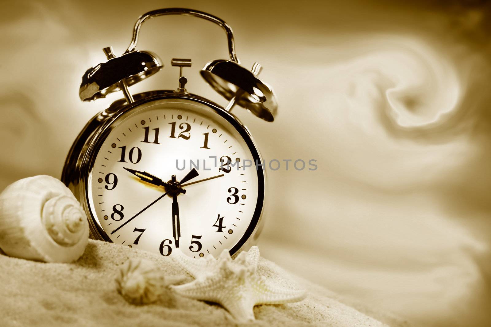 Alarm clock showing time on the beach with seashells/Sepia tone