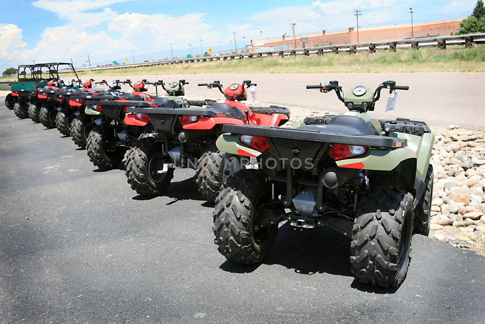 A row of new all-terrain vehicles ready to hit the trails 