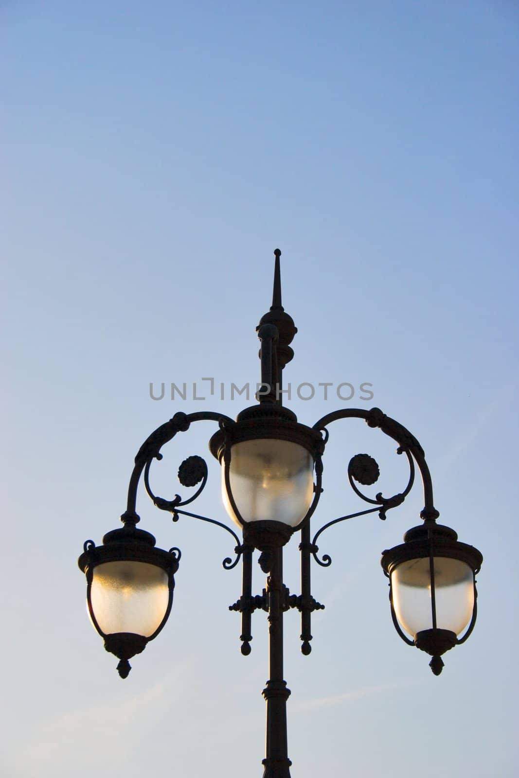 One lamp post on sky background 