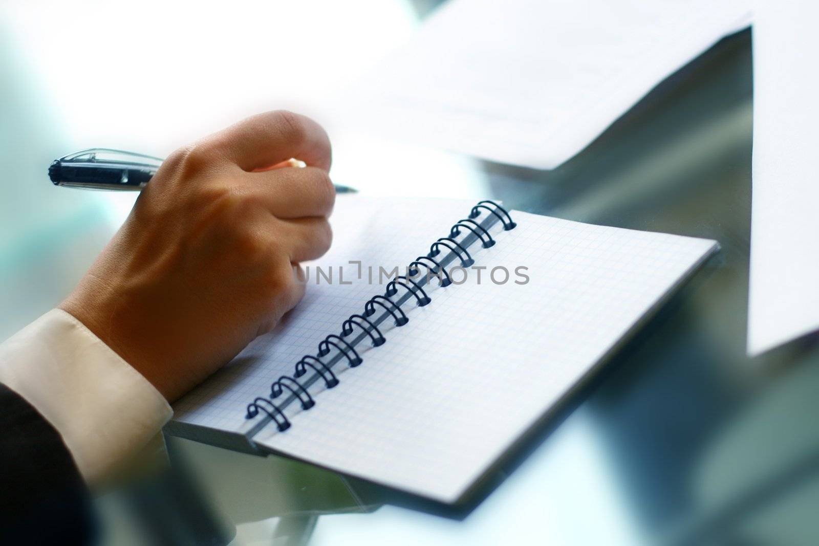 businessman hand write message in note 