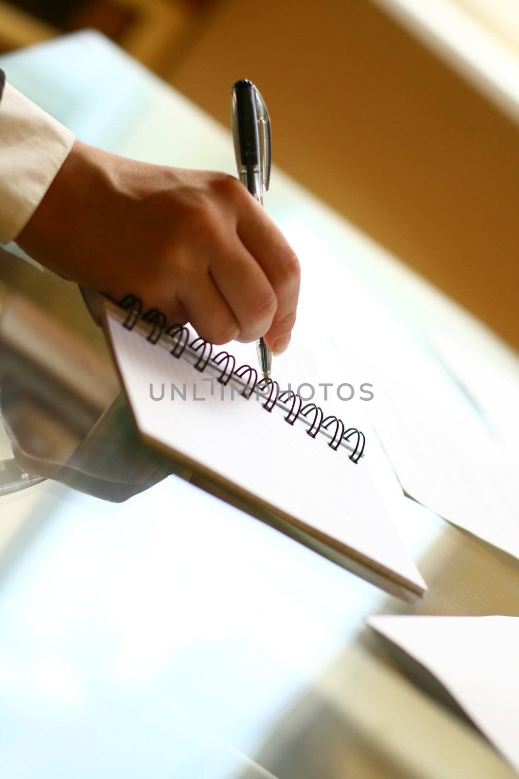 businessman hand write message in note 