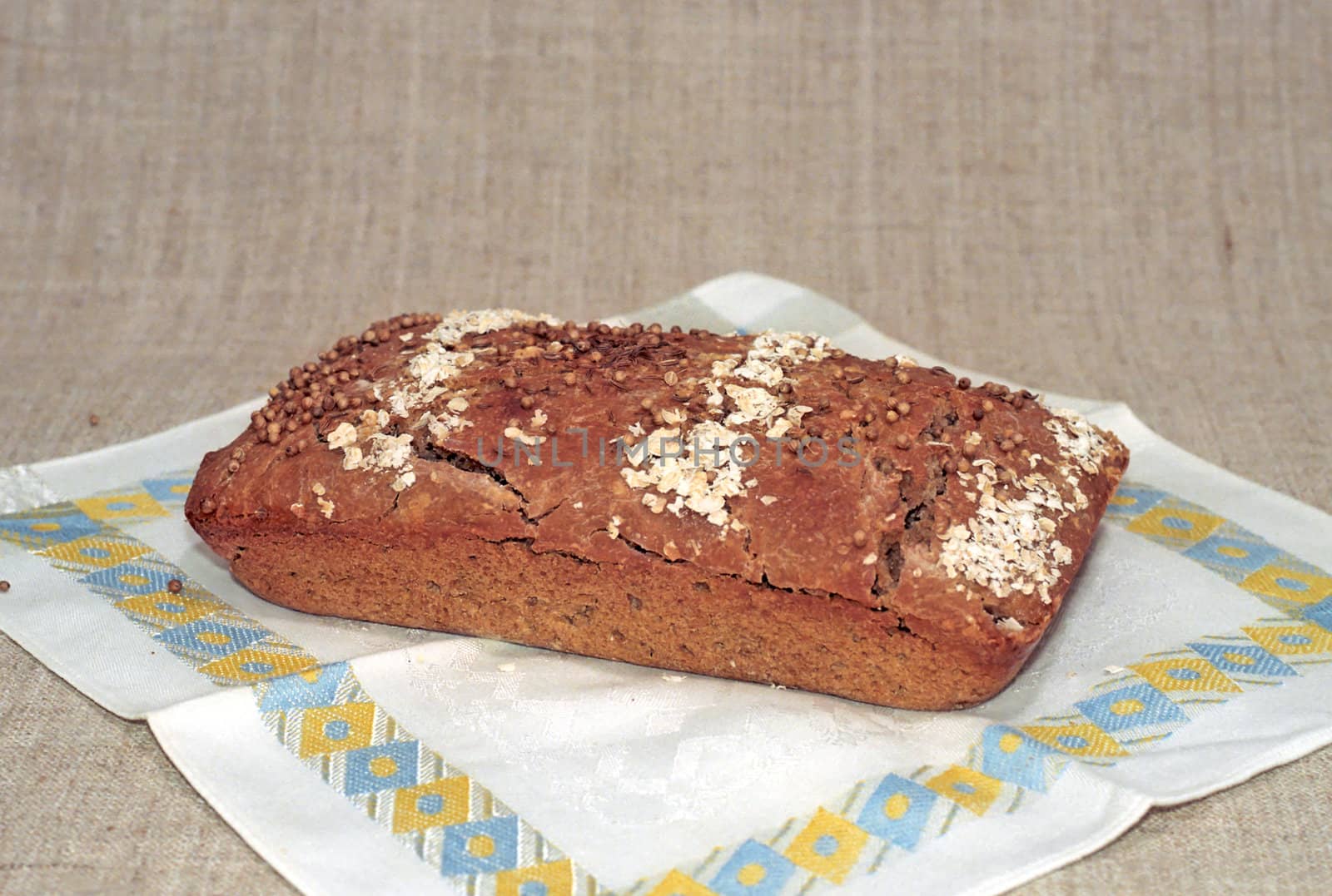 A loaf of rye bread on dish-cloth