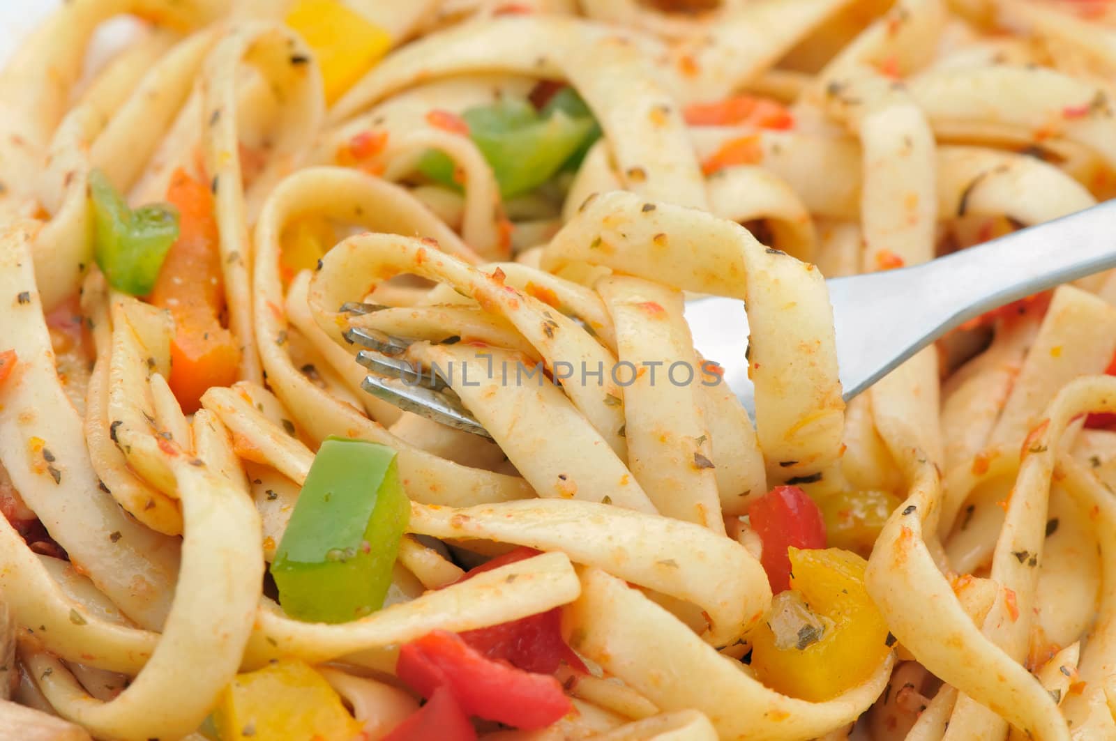 Fresh pasta salad with multi colored pepper dices