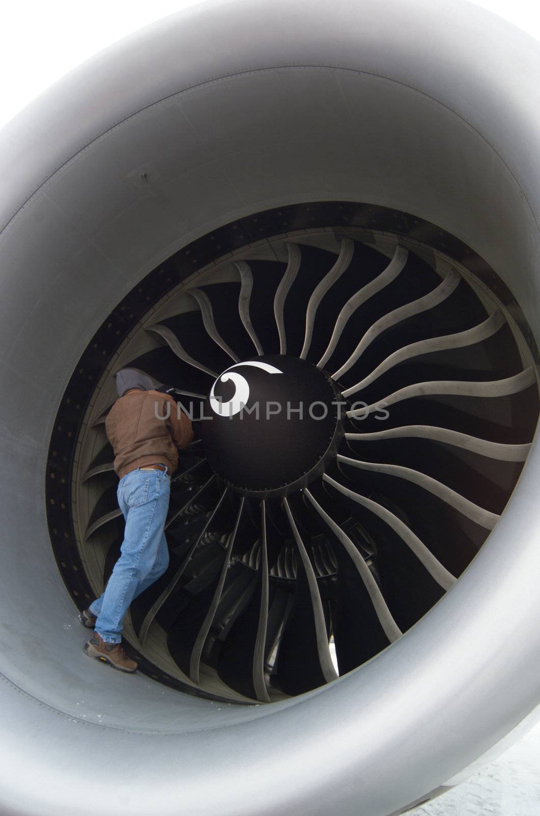 man in turbine of jet liner