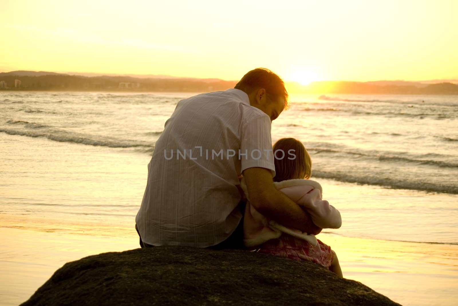 Father and Daughter playing at the beach