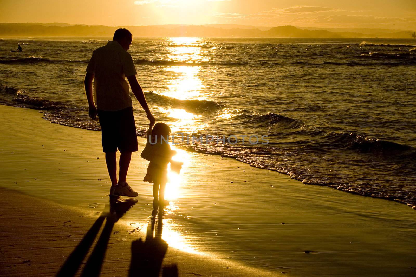 Father and daughter at beach sunset by angietakespics