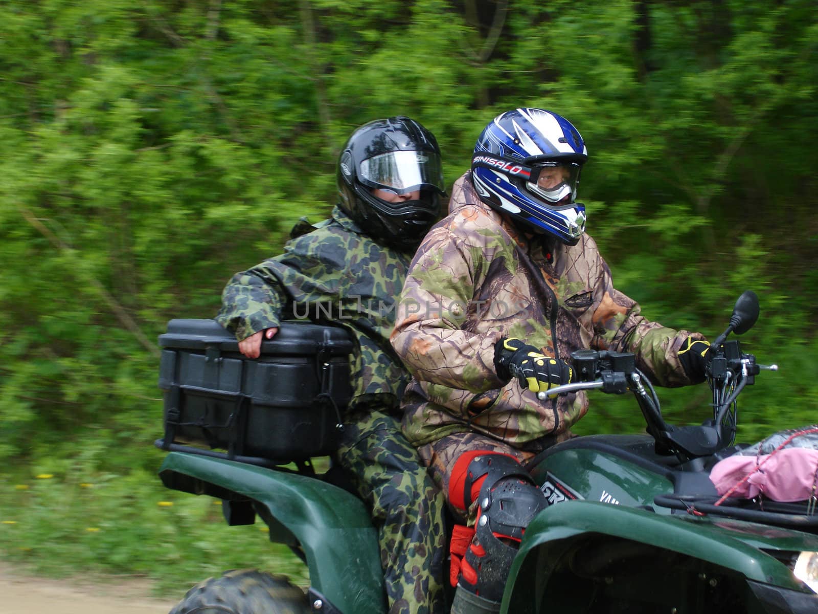 Driving on a motorcycle on a cross-country terrain                               