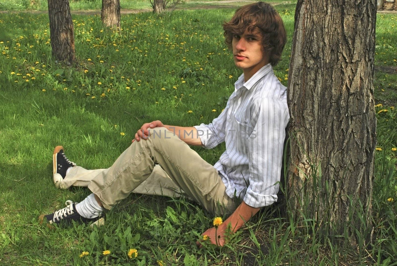 the young man near the tree