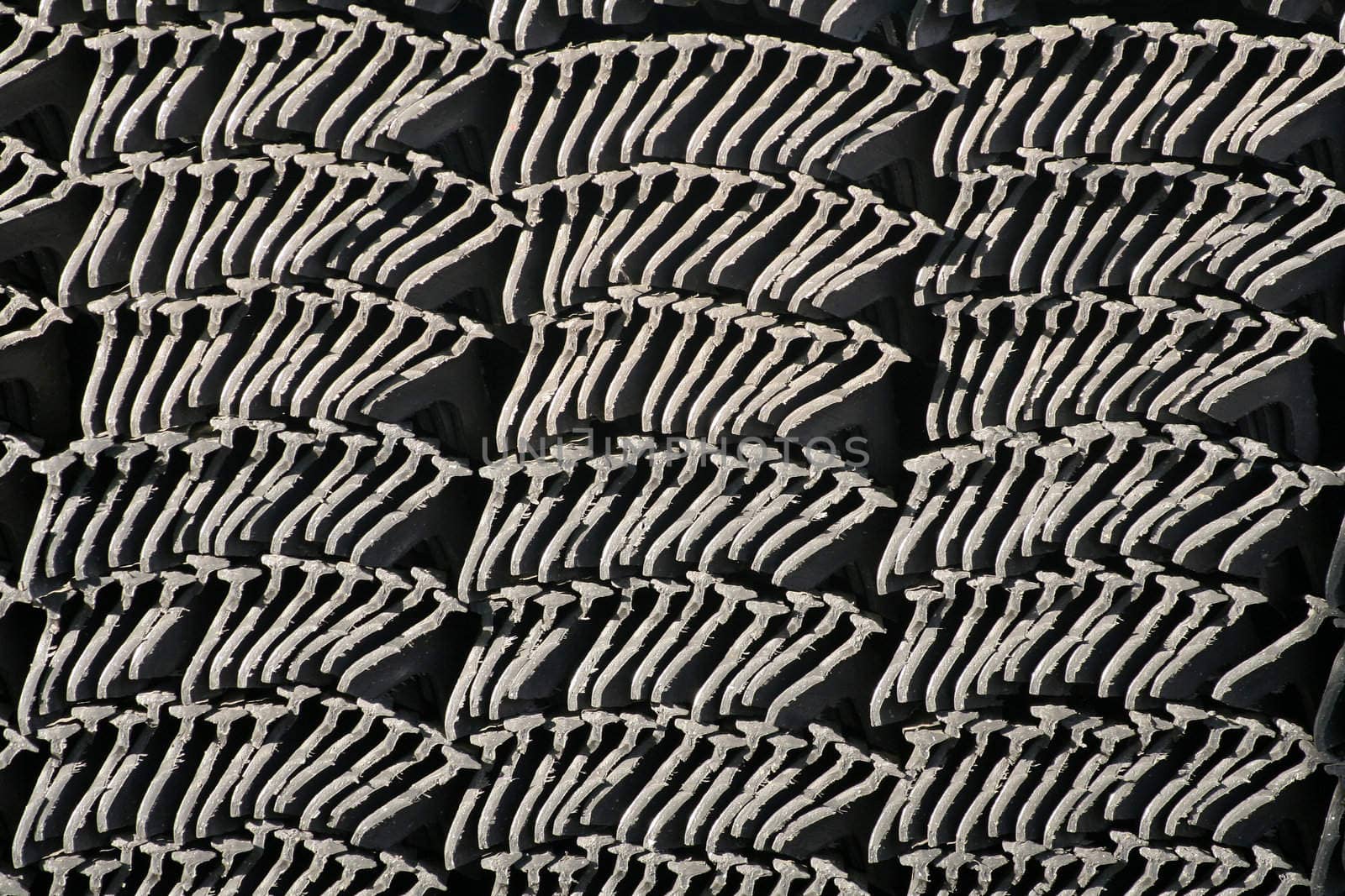 A stack of sealing fillets, material on a construction site for residential buildings. Very abstract background pattern.