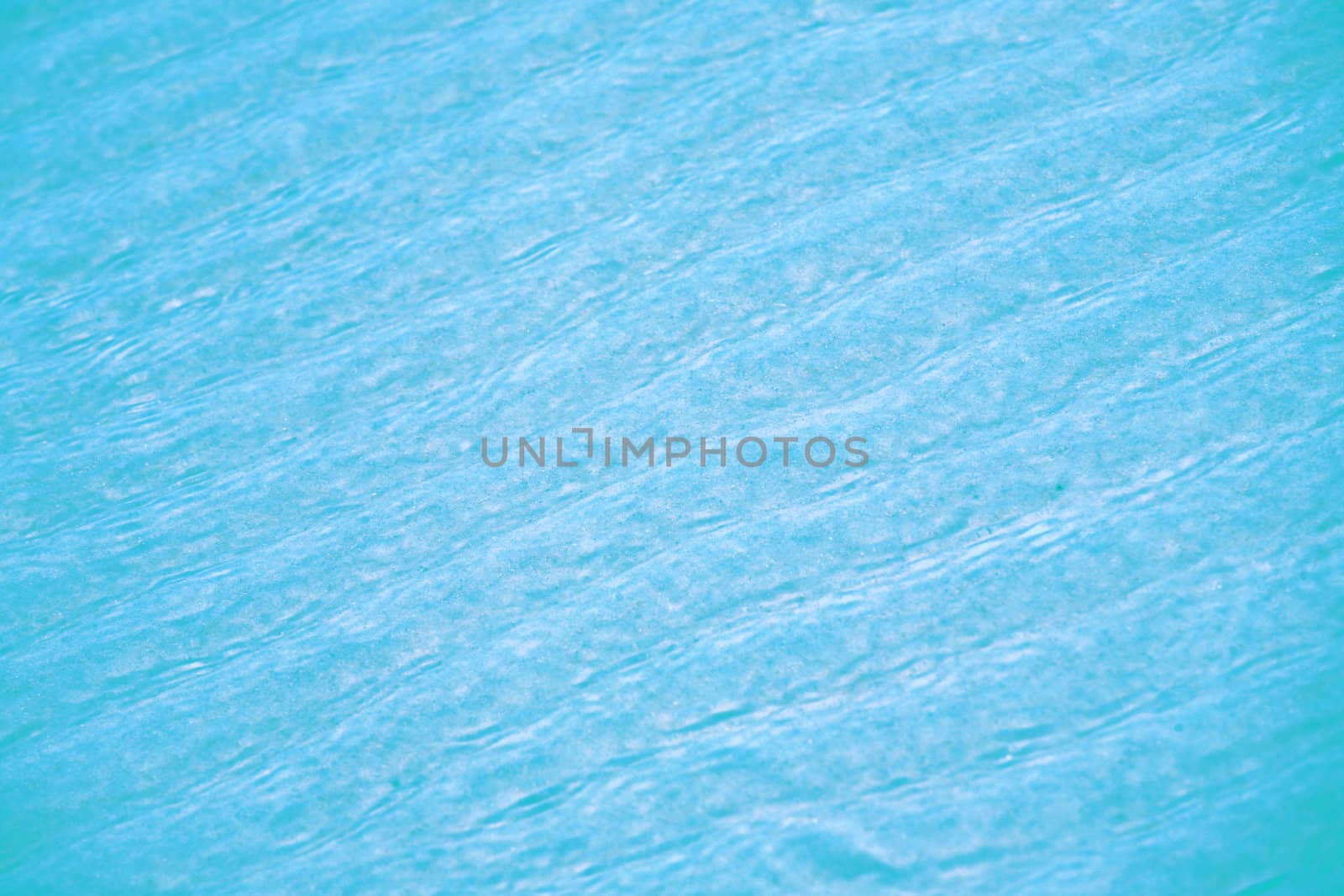 Soft Blue ripples of water over sandy bottom