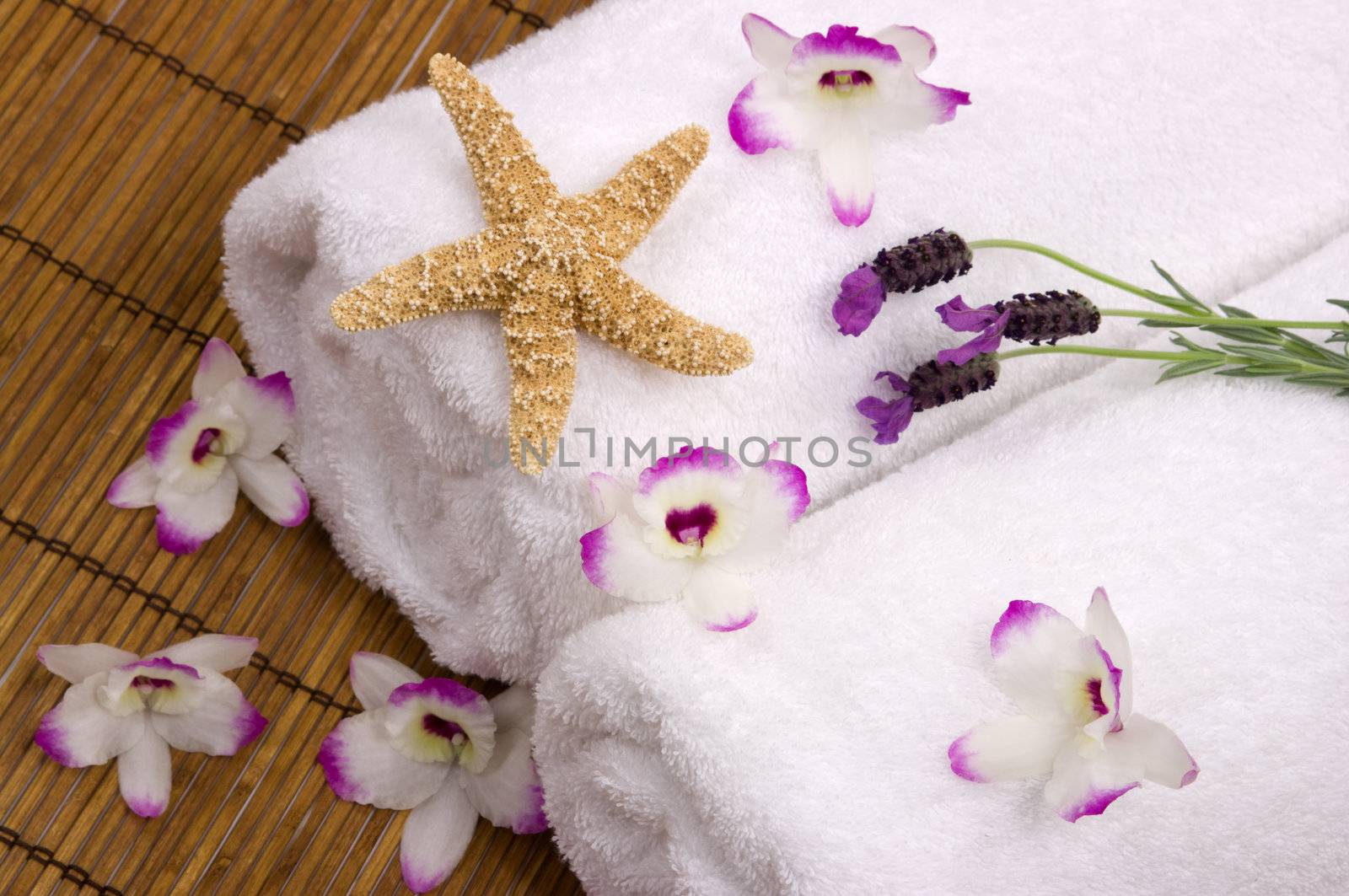 Spa with soft towels, exotic orchids, aromatic lavender and a starfish