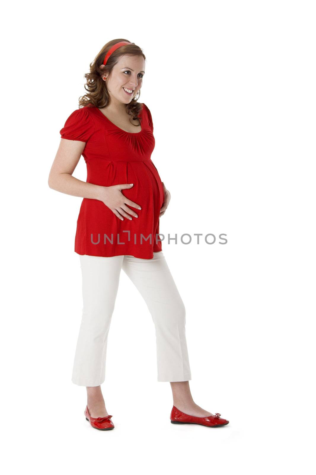 Beautiful pregnant woman on white enjoying this wonderful moment 