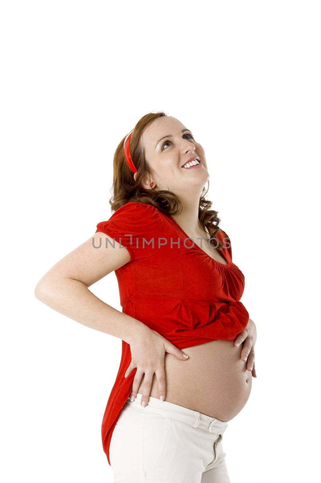 Beautiful pregnant woman on white enjoying this wonderful moment 