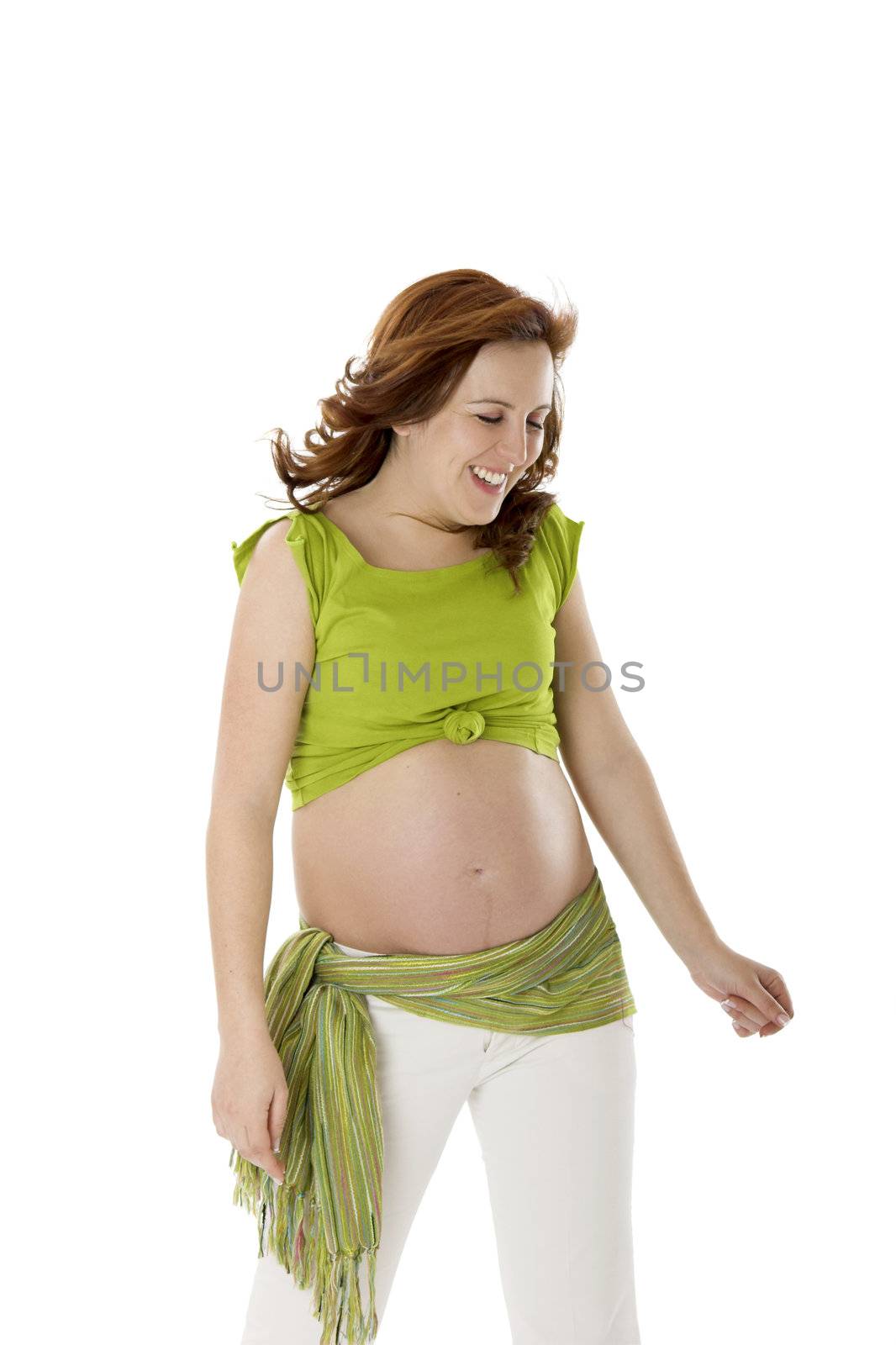 Beautiful pregnant woman on white enjoying this wonderful moment 