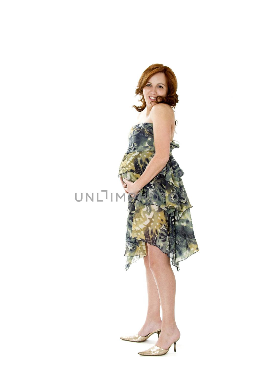 Pregnant woman posing on white with beautiful dress
