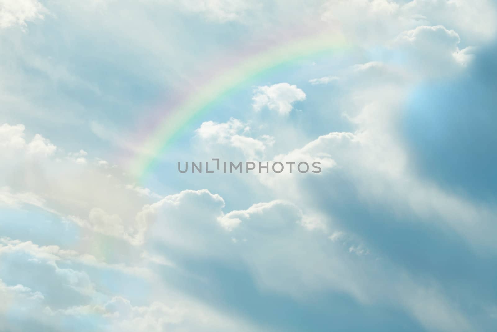 Beautiful clouds in blue sky with rainbow by jarenwicklund