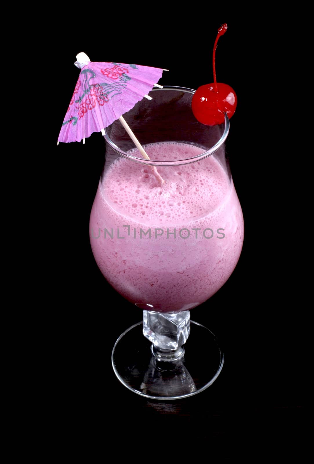 Cerise milkshake in glass goblet with dressing