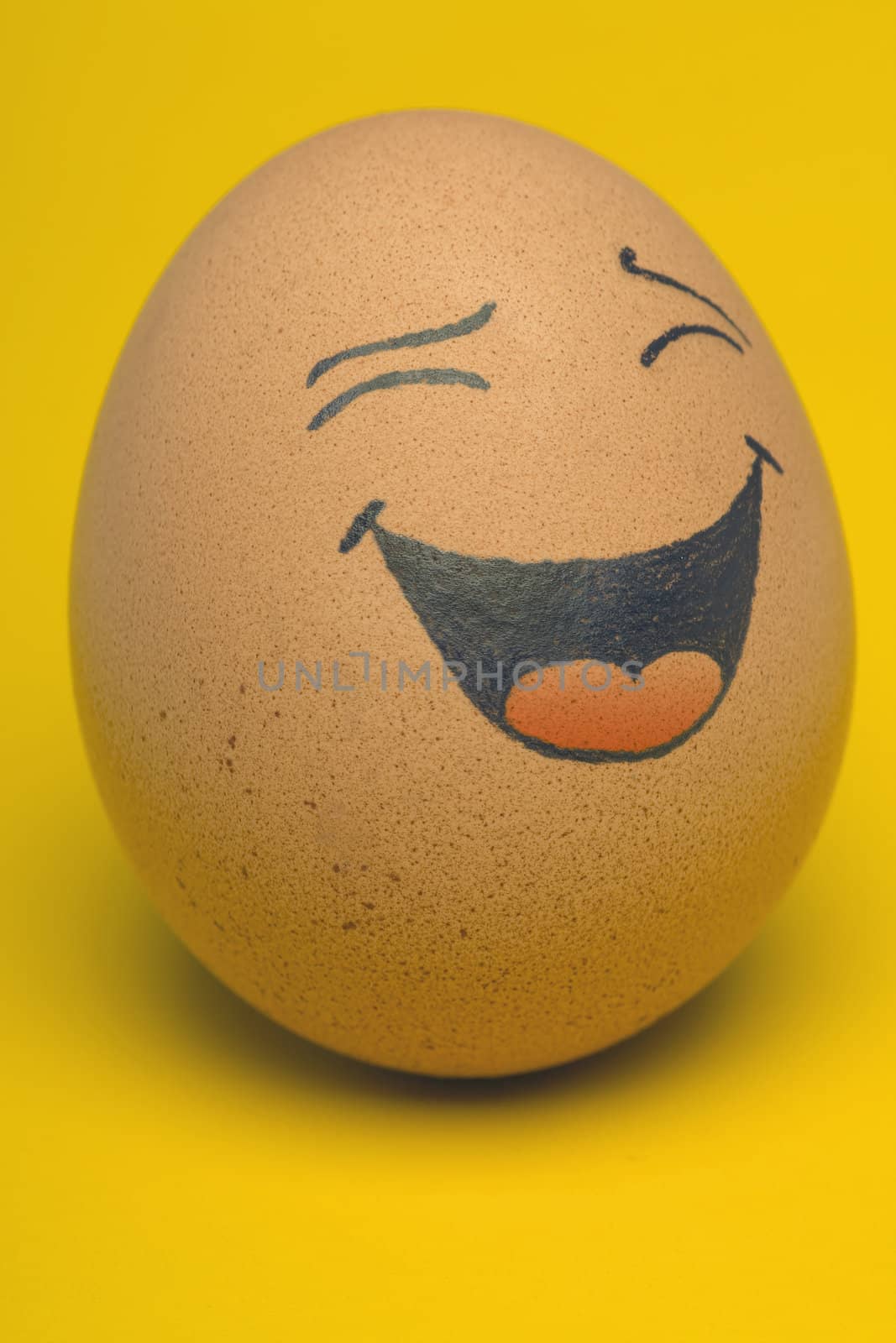 Single, Smiling comical Egg with yellow background.