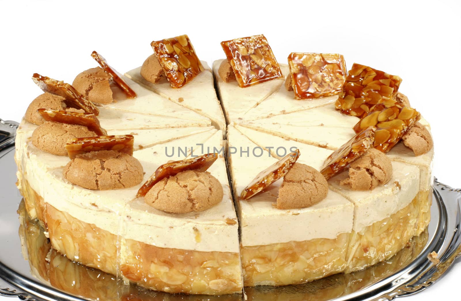 Nut cake with cream stuffing and peanuts in caramels