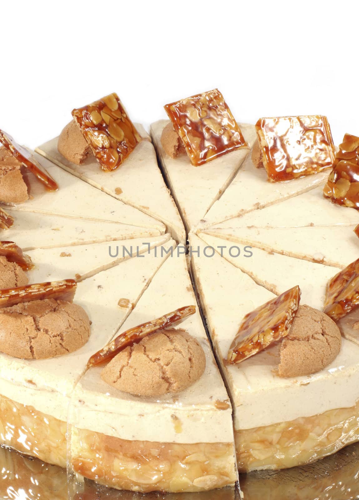 Nut cake with cream stuffing and peanuts in caramels