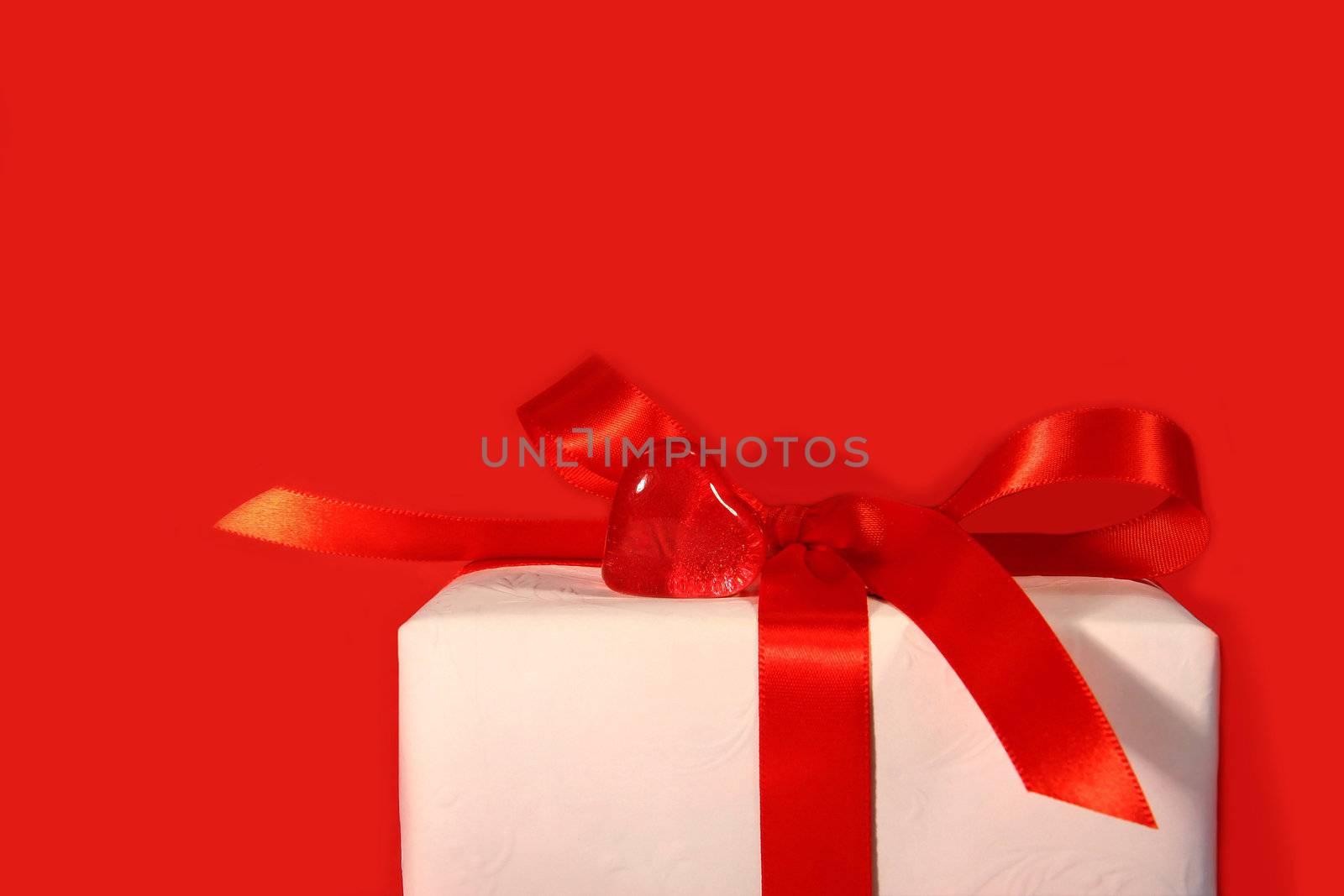 Heart and red bow with red background
