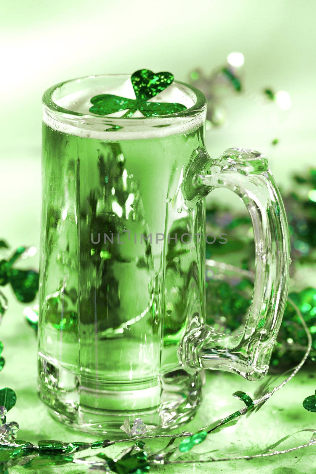 Mug of green beer for St Patick's Day festivities/ Green tone