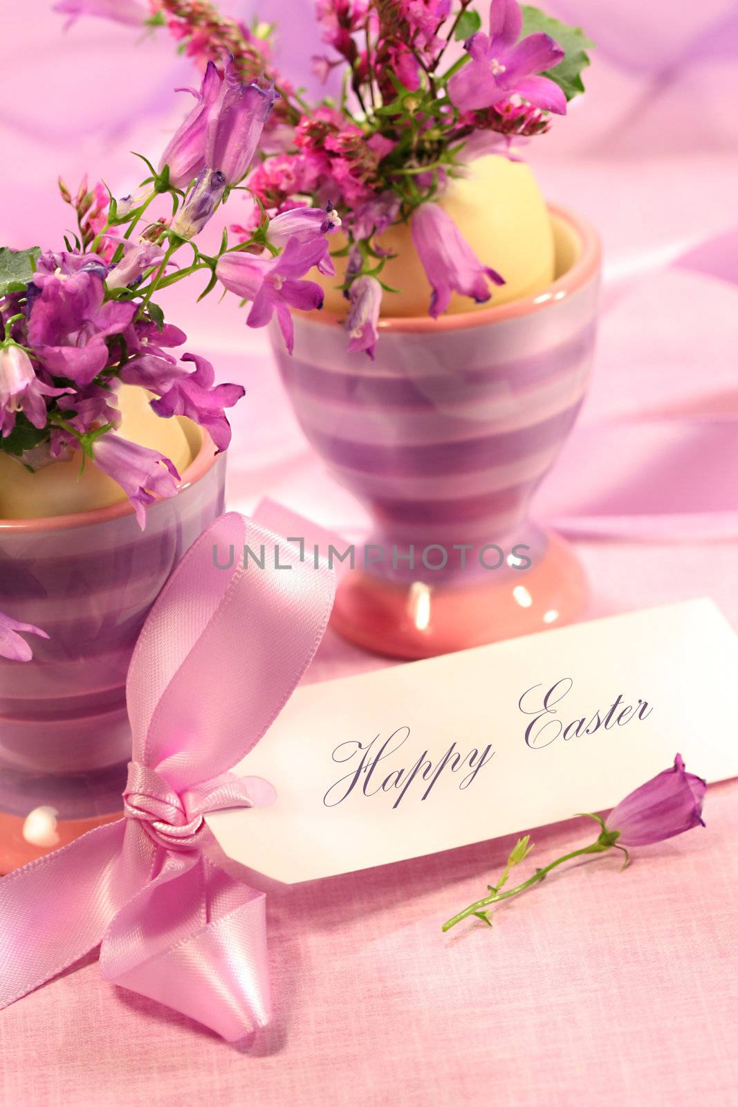 Purple flowers in eggs cups for Easter
