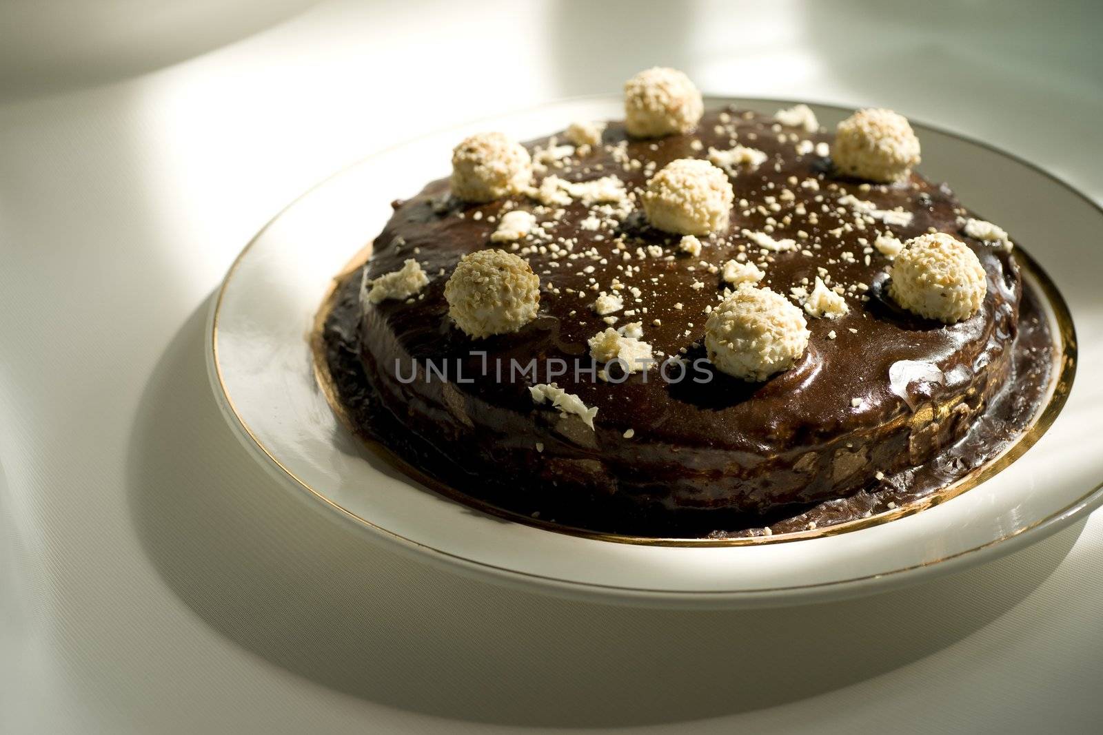 Chocolate cake with sweet decoration on the plate