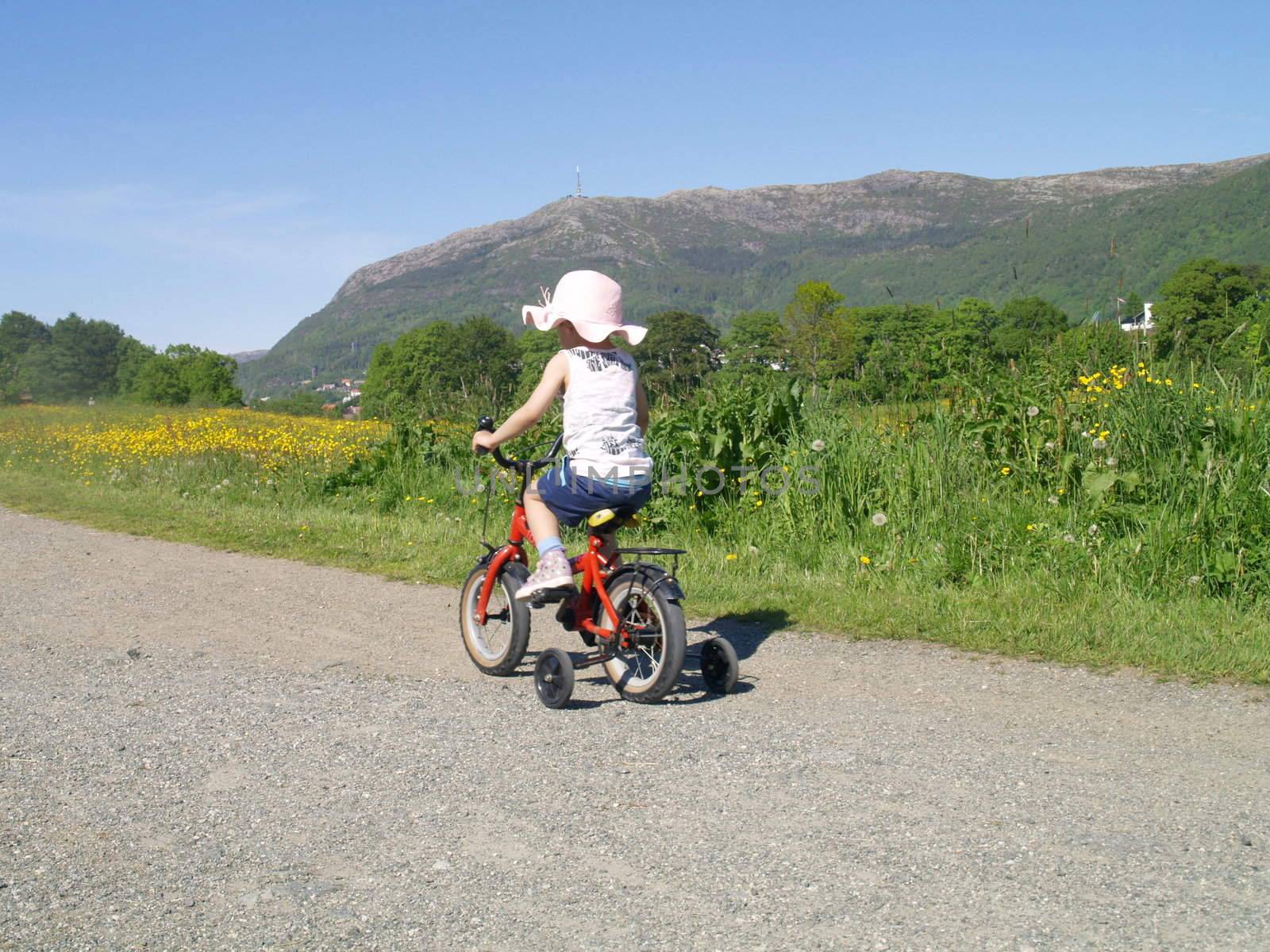 bicycling child by viviolsen