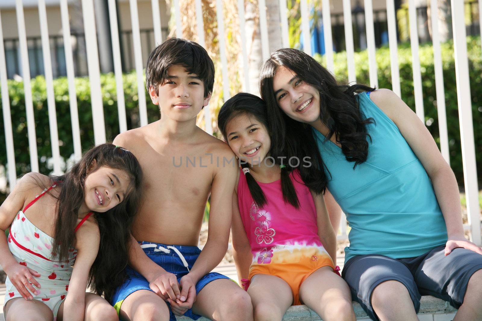 Four children enjoying the pool together