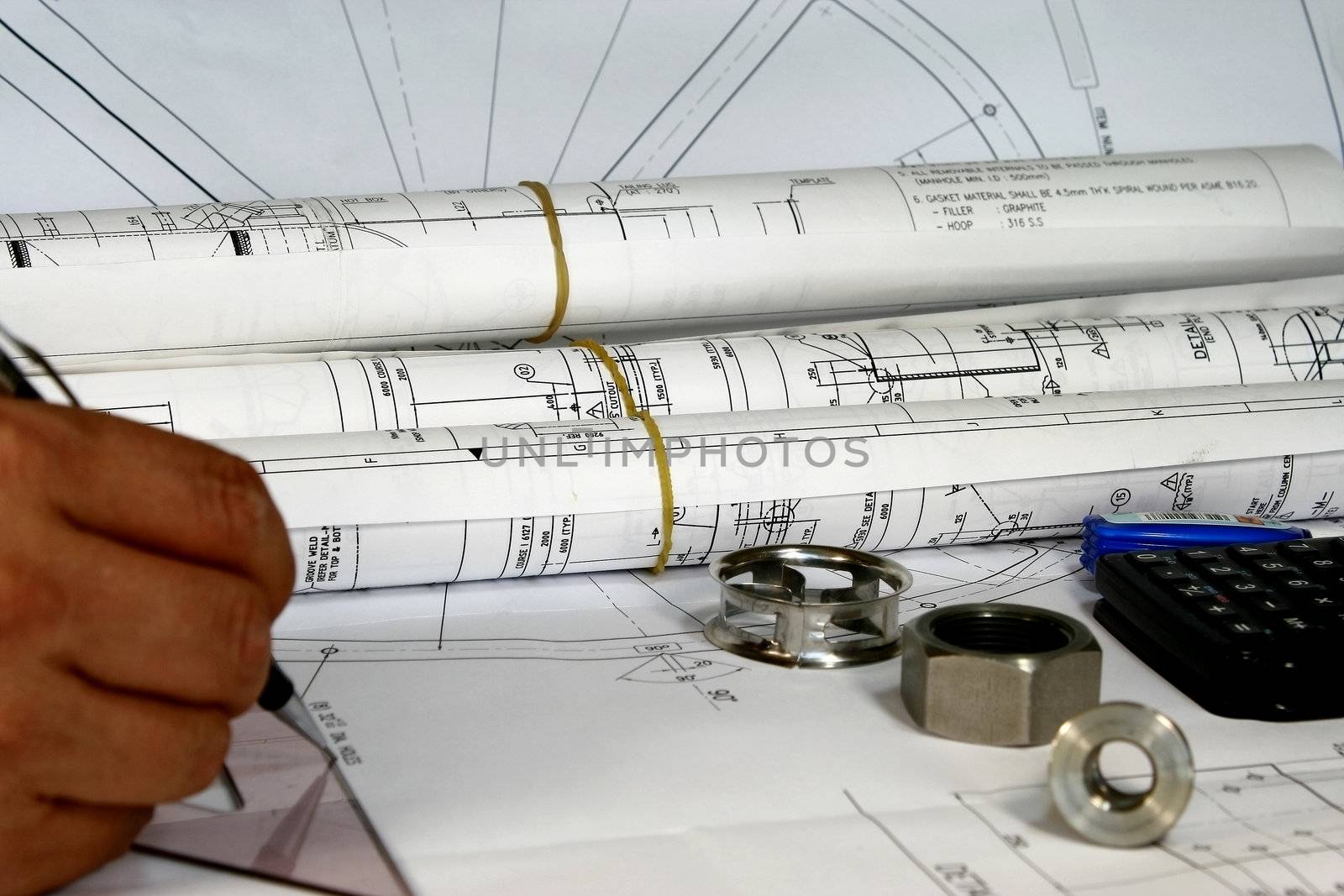 Mmechanical Engineering Tools with blueprints and parts