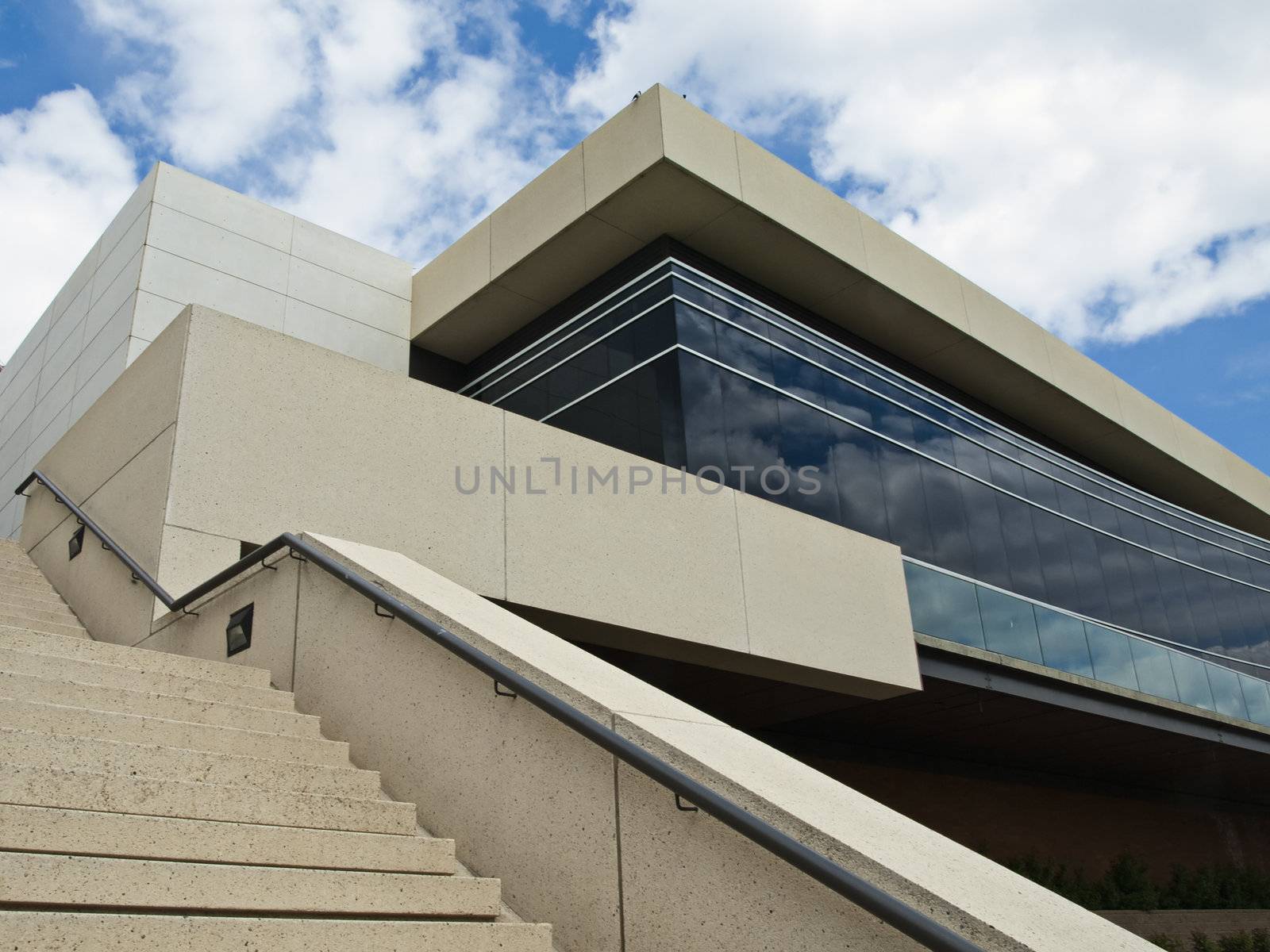 Exterior view of a conference building and stairs.