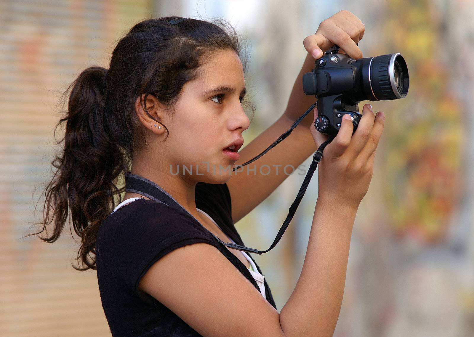 teenager with didital camera by Maya