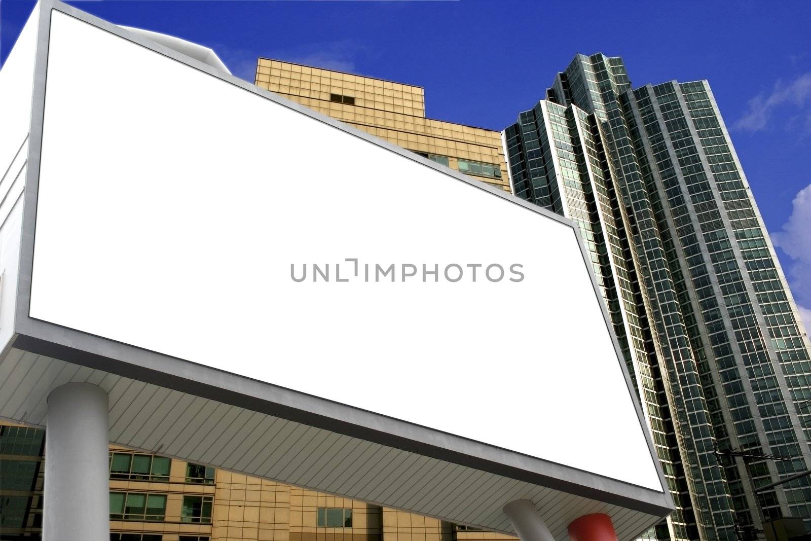 Blank Billboard ready for commercial use with building background