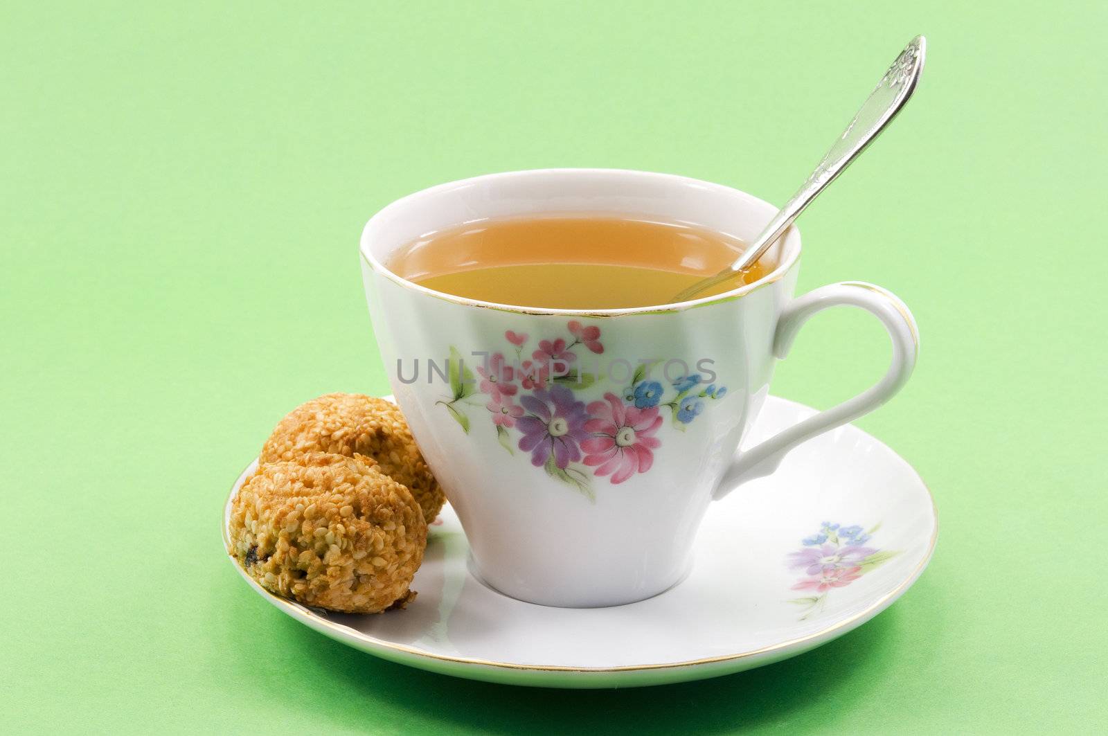 	
A cup of tea and two balls of coconut biscuits
