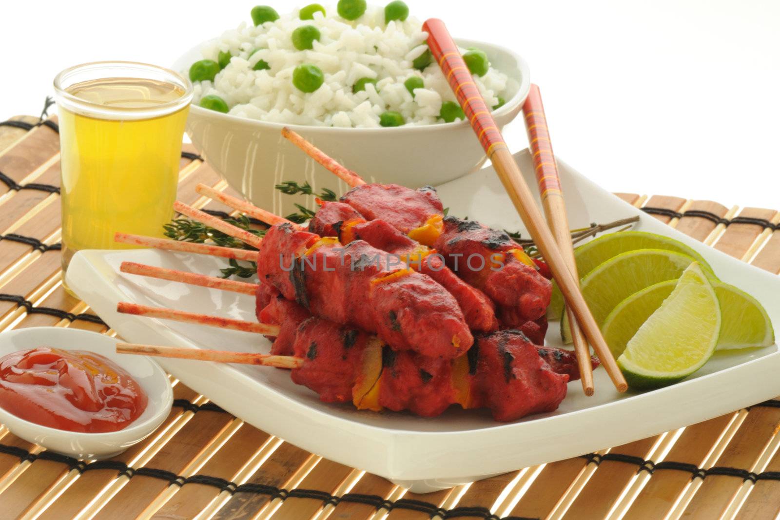 Spicy chicken satay served with white rice.