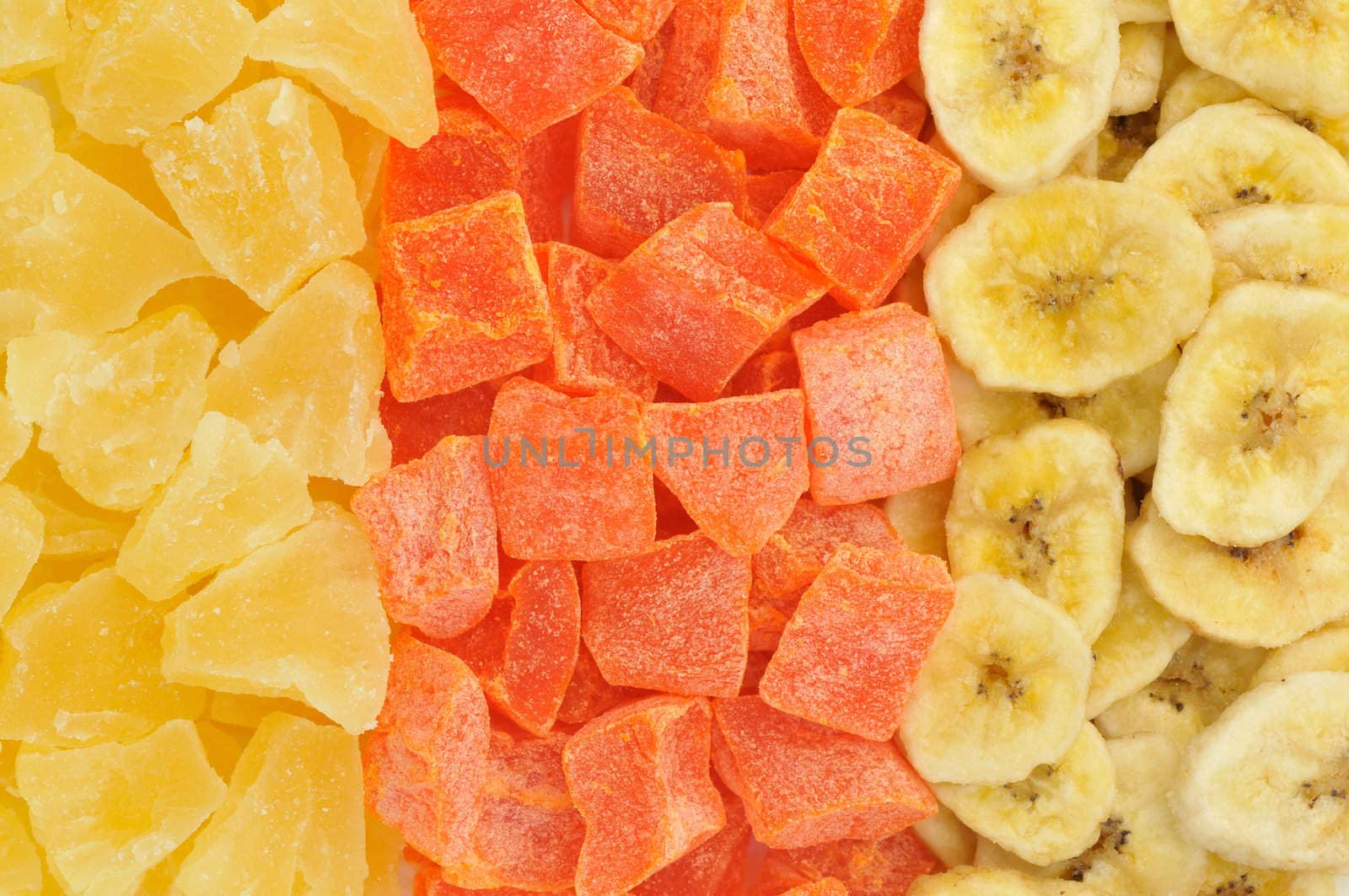 Top view of dried papaya, pineapple and banana slices